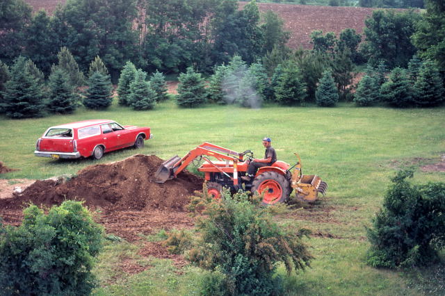 Samolyk moving the excess excavated dirt